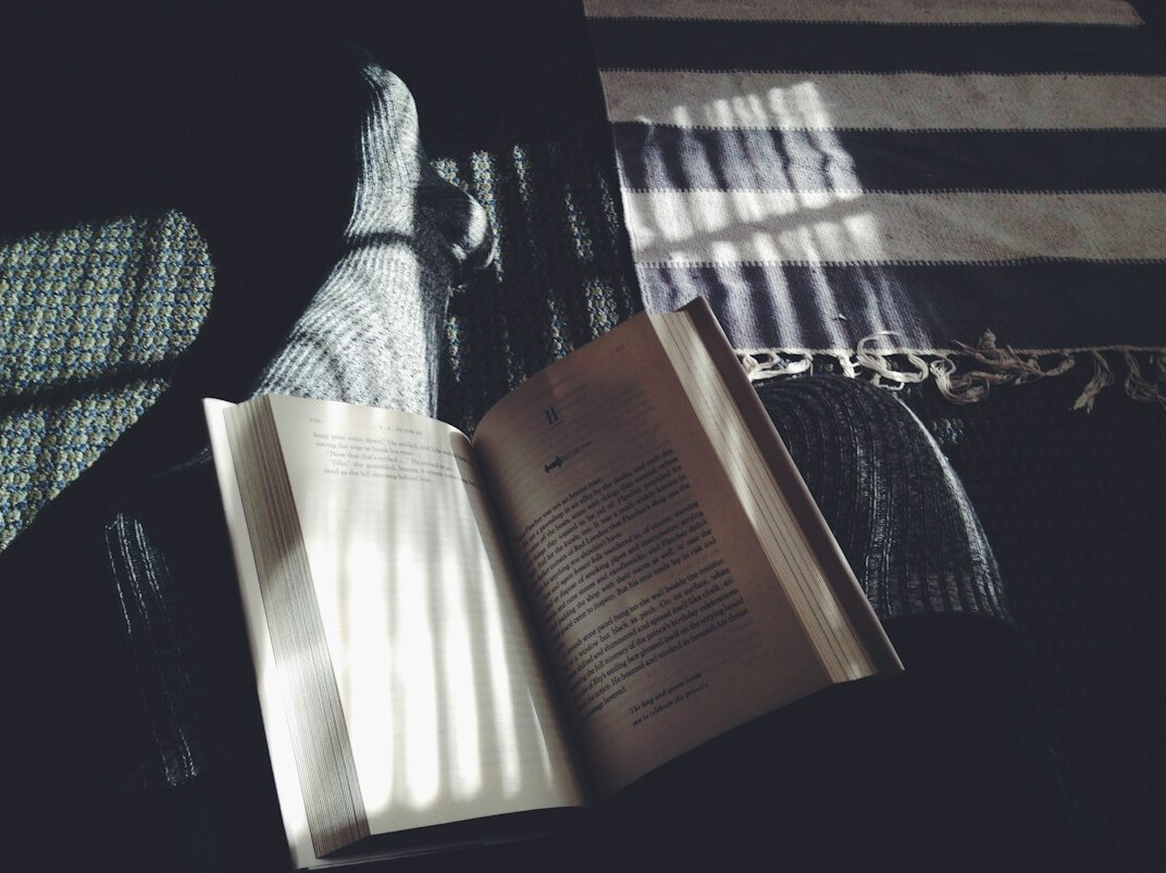 person reading book at night
